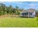 Backyard featuring a fire pit area and a charming porch, perfect for entertaining guests at 105 Plowden Mill Ct, Summerville, SC 29485