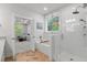 Bright bathroom with a separate tub and shower, complemented by elegant tile work and a herringbone floor at 105 Plowden Mill Ct, Summerville, SC 29485