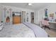 Bright bedroom featuring a desk area, ceiling fan, and access to the ensuite bathroom at 105 Plowden Mill Ct, Summerville, SC 29485