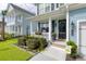 Inviting front porch with a cozy seating area, charming decor, and a well-maintained garden, creating a welcoming entrance at 105 Plowden Mill Ct, Summerville, SC 29485