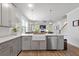 Stylish kitchen featuring stainless steel appliances, a center island with a farmhouse sink, and an open concept design at 105 Plowden Mill Ct, Summerville, SC 29485