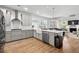 Well-designed kitchen with a stainless steel refrigerator, modern appliances, and an open layout to the living room at 105 Plowden Mill Ct, Summerville, SC 29485