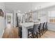 Kitchen island with seating and pendant lighting is adjacent to stainless appliances at 105 Plowden Mill Ct, Summerville, SC 29485