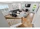 Spacious living room with hardwood floors, a fireplace, large sectional, and comfortable seating at 105 Plowden Mill Ct, Summerville, SC 29485