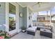 Covered back porch with comfortable seating and decor at 105 Plowden Mill Ct, Summerville, SC 29485