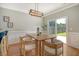 Bright dining area with sliding glass doors and modern light fixture at 1052 Whitlow Blvd, Summerville, SC 29483