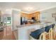 Cozy kitchen with wood cabinets, stainless steel appliances, and bar seating at 1052 Whitlow Blvd, Summerville, SC 29483