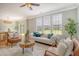Cozy living room with comfortable seating, ample natural light, and view into the dining area at 1052 Whitlow Blvd, Summerville, SC 29483