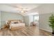 Spacious primary bedroom with a sloped ceiling, wood floors and a sitting area at 1052 Whitlow Blvd, Summerville, SC 29483
