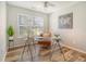 Home office space with a glass desk, leather chair, and a window view at 1052 Whitlow Blvd, Summerville, SC 29483