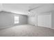 Spacious bedroom with neutral carpet, ceiling fan, large closet, and a window at 1070 Moss Grove Dr, Moncks Corner, SC 29461