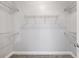 Walk-in closet with wire shelving for optimal storage and organization and neutral carpeting at 1070 Moss Grove Dr, Moncks Corner, SC 29461