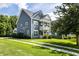 Inviting home featuring attractive siding, well-manicured lawn, and a charming double balcony at 1070 Moss Grove Dr, Moncks Corner, SC 29461