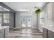 Modern kitchen and dining area with stainless appliances, white countertops, and stylish doors at 1070 Moss Grove Dr, Moncks Corner, SC 29461