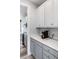 Well-organized kitchen featuring white countertops, gray cabinetry, and stainless coffee maker at 1070 Moss Grove Dr, Moncks Corner, SC 29461