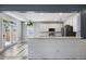 This kitchen features a sleek breakfast bar and ample counter space, seamlessly connecting to the adjacent dining area at 1070 Moss Grove Dr, Moncks Corner, SC 29461