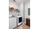 Convenient laundry room with a washer and dryer, storage shelf, and hard surface flooring at 1070 Moss Grove Dr, Moncks Corner, SC 29461