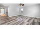 The open-concept living space boasts wood-look floors and neutral paint at 1070 Moss Grove Dr, Moncks Corner, SC 29461