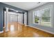 Bright living room with hardwood floors, large windows, and architectural columns at 1070 Moss Grove Dr, Moncks Corner, SC 29461