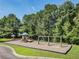 Community playground with a slide, swings, and picnic tables provides a fun and safe play area for children at 1070 Moss Grove Dr, Moncks Corner, SC 29461