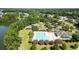 Community pool surrounded by lush trees, showcasing an inviting area for relaxation and recreation at 1070 Moss Grove Dr, Moncks Corner, SC 29461