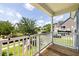 Inviting front porch with flower boxes, an American flag, and beautiful views of the neighborhood at 1070 Moss Grove Dr, Moncks Corner, SC 29461