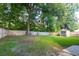 Fenced backyard featuring a storage shed, mature trees, and a well-maintained lawn at 109 Ashdown Dr, Summerville, SC 29483