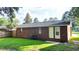 Exterior backyard of a brick home with a well-maintained lawn and an air conditioning unit at 109 Ashdown Dr, Summerville, SC 29483