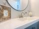 Bathroom boasts a white countertop, modern decor, and a round mirror at 109 Ashdown Dr, Summerville, SC 29483