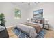Bright bedroom featuring a cozy bed, modern furnishings, and a picturesque nature print above the headboard at 109 Ashdown Dr, Summerville, SC 29483