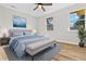 Inviting bedroom with a plush bed, soft blue accents, and large windows for ample natural light at 109 Ashdown Dr, Summerville, SC 29483