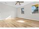 Spacious bedroom with warm wood flooring and natural light streaming through large windows at 109 Ashdown Dr, Summerville, SC 29483