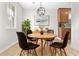 Charming dining area with a wooden table, stylish chairs, and an elegant light fixture at 109 Ashdown Dr, Summerville, SC 29483