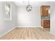 Clean dining area with light wood floors, recessed lighting, and a modern light fixture at 109 Ashdown Dr, Summerville, SC 29483