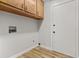 Bright laundry room with wood cabinets and convenient access to all the necessary connections at 109 Ashdown Dr, Summerville, SC 29483