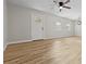 Spacious living room with light wood floors, recessed lighting, and a white interior door at 109 Ashdown Dr, Summerville, SC 29483