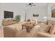 Inviting living room featuring neutral furniture, wood floors, and a large television at 109 Ashdown Dr, Summerville, SC 29483