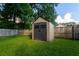 The backyard has a modern storage shed with double doors and a dark trim at 109 Ashdown Dr, Summerville, SC 29483