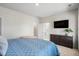 Relaxing bedroom boasts plush carpet, a dark dresser, and a flatscreen TV for ultimate comfort at 109 W Respite Ln, Summerville, SC 29483