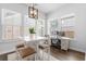 Bright dining area with stylish lighting, comfortable seating, and large windows, perfect for Gathering gatherings at 109 W Respite Ln, Summerville, SC 29483