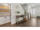 Inviting foyer with hardwood floors, stylish console table, and practical built-in storage solutions at 109 W Respite Ln, Summerville, SC 29483