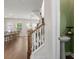 The foyer showcases the stairs and powder room. Hardwood floors and natural light enhance the inviting atmosphere at 109 W Respite Ln, Summerville, SC 29483