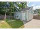 Detached garage with swing set in the backyard, perfect for outdoor activities and storage at 109 W Respite Ln, Summerville, SC 29483