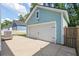 Detached garage with a white door and plenty of parking space in the driveway at 109 W Respite Ln, Summerville, SC 29483