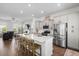 Modern kitchen features a large island with seating and stainless steel appliances, perfect for cooking and entertaining at 109 W Respite Ln, Summerville, SC 29483