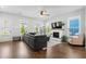 Bright living room featuring a fireplace, natural light, and an open layout, perfect for entertaining at 109 W Respite Ln, Summerville, SC 29483