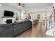 Spacious living room featuring a modern fireplace, wood floors, and an open layout to the kitchen at 109 W Respite Ln, Summerville, SC 29483