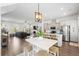 Bright, open-concept living space showcasing a modern kitchen, dining area, and comfortable living room at 109 W Respite Ln, Summerville, SC 29483