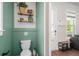 Charming powder room features a modern pedestal sink and decorative wall accents, adding a touch of elegance at 109 W Respite Ln, Summerville, SC 29483