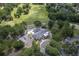 Aerial view of a golf course community showing the clubhouse, course layout, and surrounding mature trees at 109 Waveney Cir, Goose Creek, SC 29445